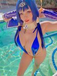 Pattie Cosplay poses by the pool