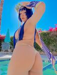 Pattie Cosplay poses by the pool