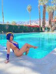 Pattie Cosplay poses by the pool