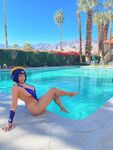 Pattie Cosplay poses by the pool